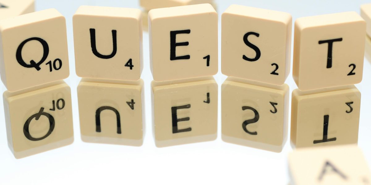 A journalist intensely focused on their work, emphasizing the need for relevant and concise pitches that stand out.