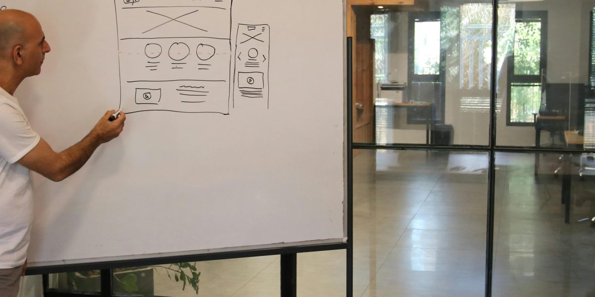 A focused individual using a drag-and-drop interface, visually creating a website with ease and concentration.
