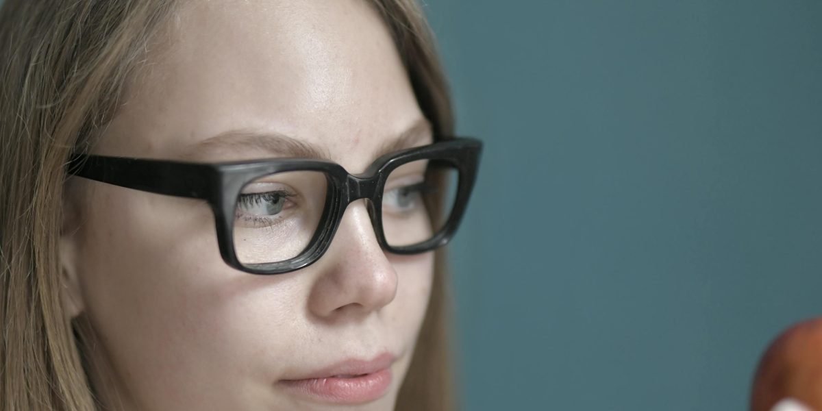 A person deep in thought, contemplating important decisions for a new venture, reflecting the crucial platform choice.