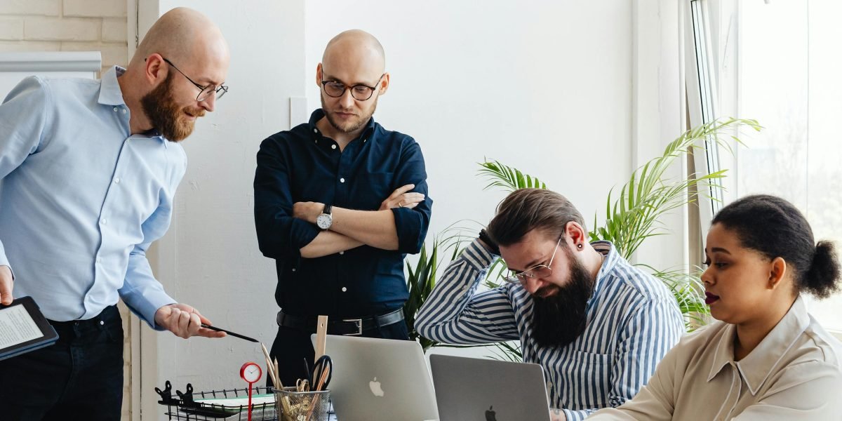 A team collaborates to understand and strategize different business models.