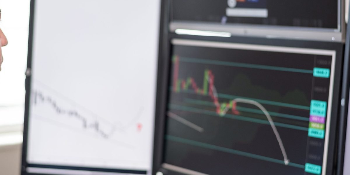 A professional analyzing data on a dashboard, illustrating the importance of tracking metrics for business growth.