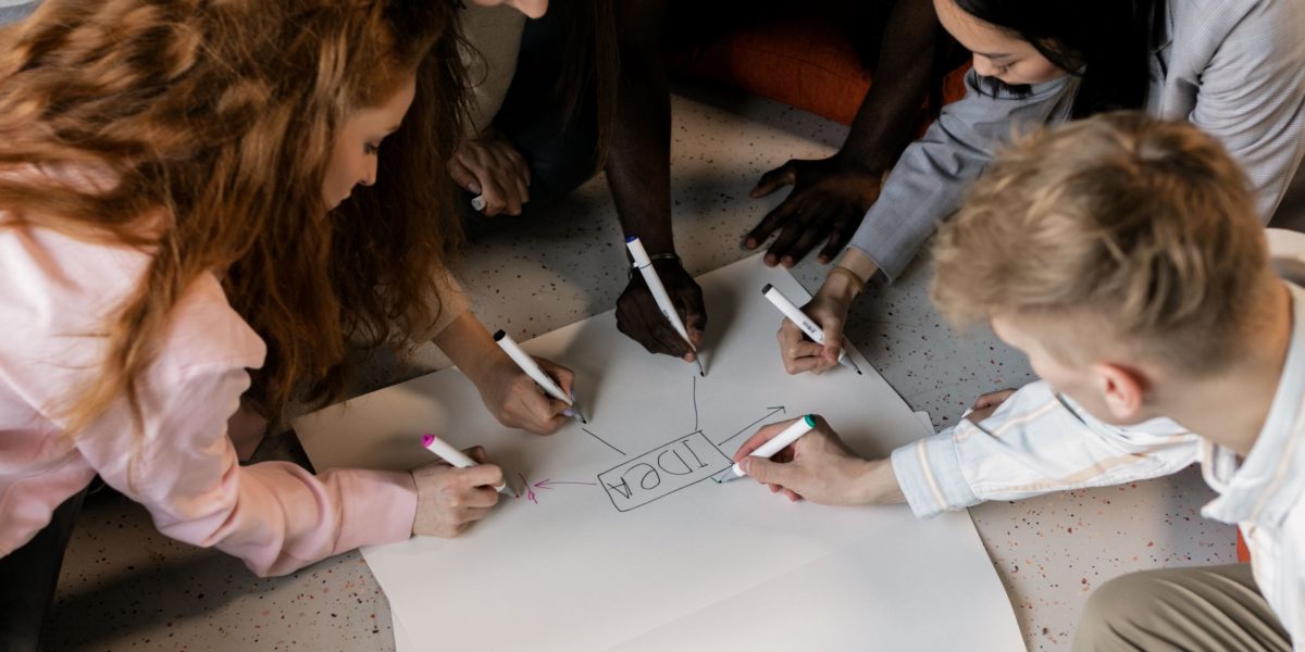 People collaborating and brainstorming ideas for engaging content.