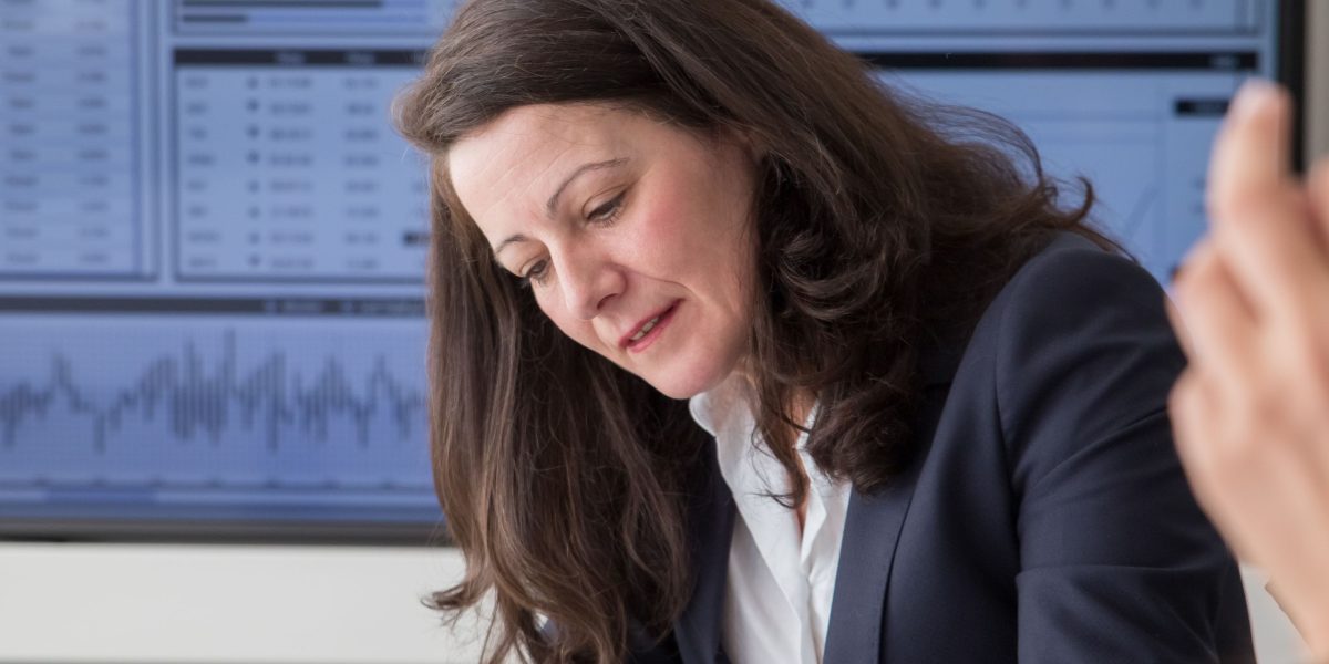 A professional reviewing data to make informed decisions and optimize.