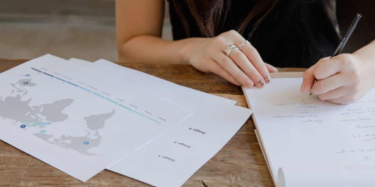 A person carefully planning a business strategy, reflecting the strategic approach needed for affiliate marketing success.