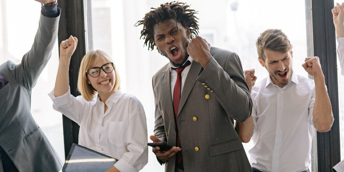 A person celebrating a business achievement, representing the successful outcome of maximizing affiliate earnings.